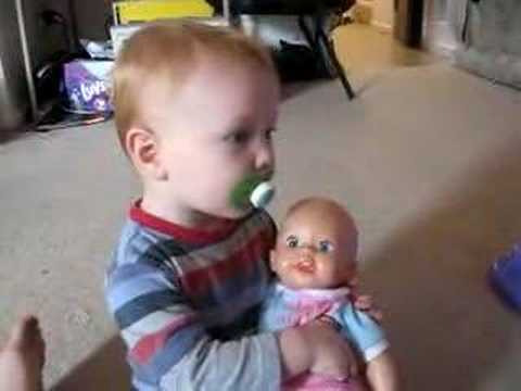 Asher playing with a Baby Doll