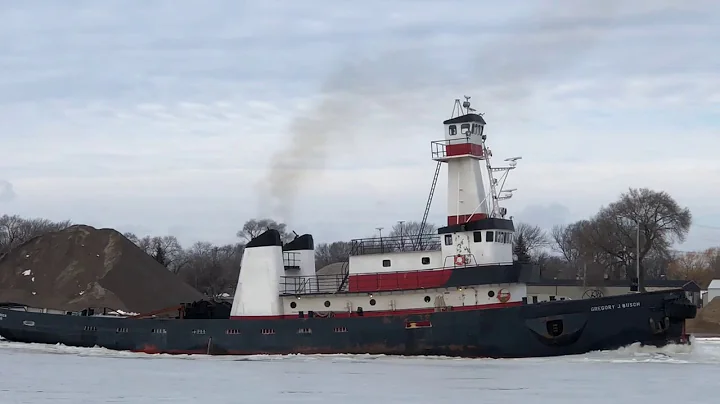 The tug Gregory J. Busch breaks ice on the Saginaw...