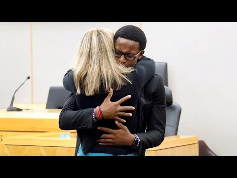 Brother of murdered Botham Jean hugs ex-police officer Amber Guyger in Dallas court