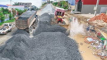 Impressive Processing making way by skill Komatsu dozer pushing gravel with 25.5T dump truck