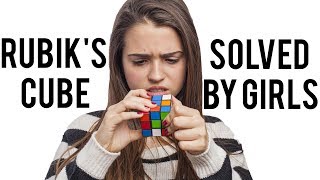 Rubik&#39;s cube being solved by girls