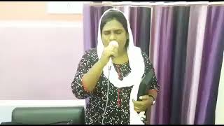 Prophet Sister Indira sing a song at New life Church