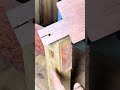 Assembling strong traditional wood joints and cutting a thick wooden board using a table saw machine