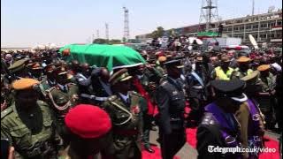 President Michael Sata’s body returns to Zambia amid splits in ruling party