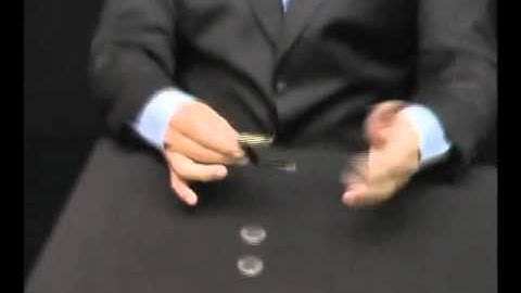 Slippery Expanded Shell Eisenhower Dollar  by Tango - at Penguin Magic