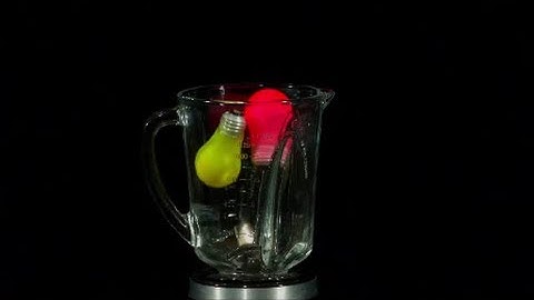 Slow Motion Color Light Bulbs Exploding in a Blender on High Definition HD Slow Mo Video Camera Shot