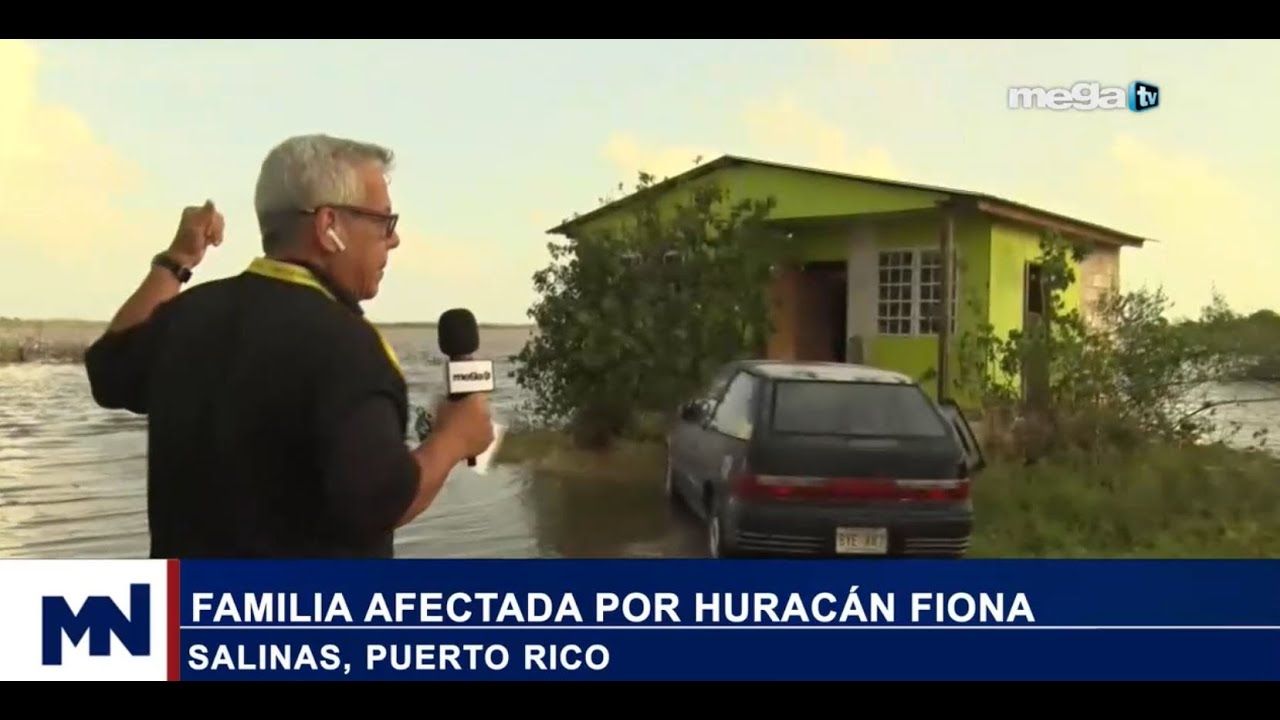 Familia afectada por huracán Fiona en Salinas, Puerto Rico