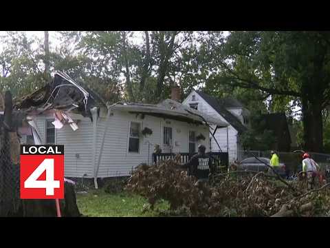 Volunteers help remove tree on family's home on Detroit's west side
