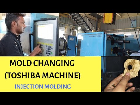 MOLD CHANGING INJECTION MOLDING MACHINE ( TOSHIBA