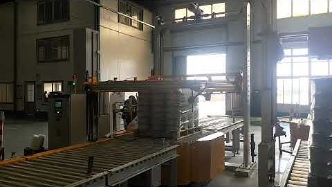 Online pallet wrapper with top sheet dispenser