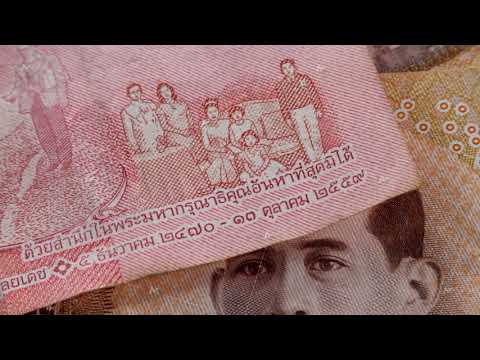 Brown 1000 baht and red 100 baht banknote THB