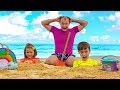 Max and daddy with Katy playing on the Beach