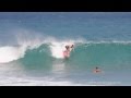 Surfer surfing a quad fin retro fish surfboard at rocky point in hawaii by paul topp