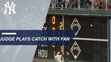 Judge plays catch with a young fan in Philly