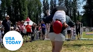 Husbands compete in wife-carrying contest | USA TODAY