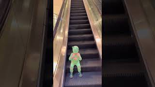 Funny Baby Hiding His Facegoing On Escalator No Fear 