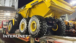 Komatsu HM400 on the Move  Loading and Transporting Articulated Truck