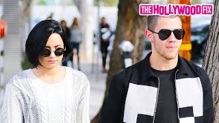 Video voorbeeld van "Demi Lovato & Nick Jonas Step Out For A Lunch Date Together With Her Dog Batman In West Hollywood CA"