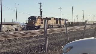 UP 1390 makes a reverse move along with 4111 and 2562