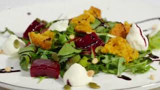 Salad with herring, beetroot, paprika, red onion, mustard and balsamic vinegar. Salad of lettuce