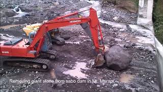 Removing giant stone from sabo dam in Mt.Merapi