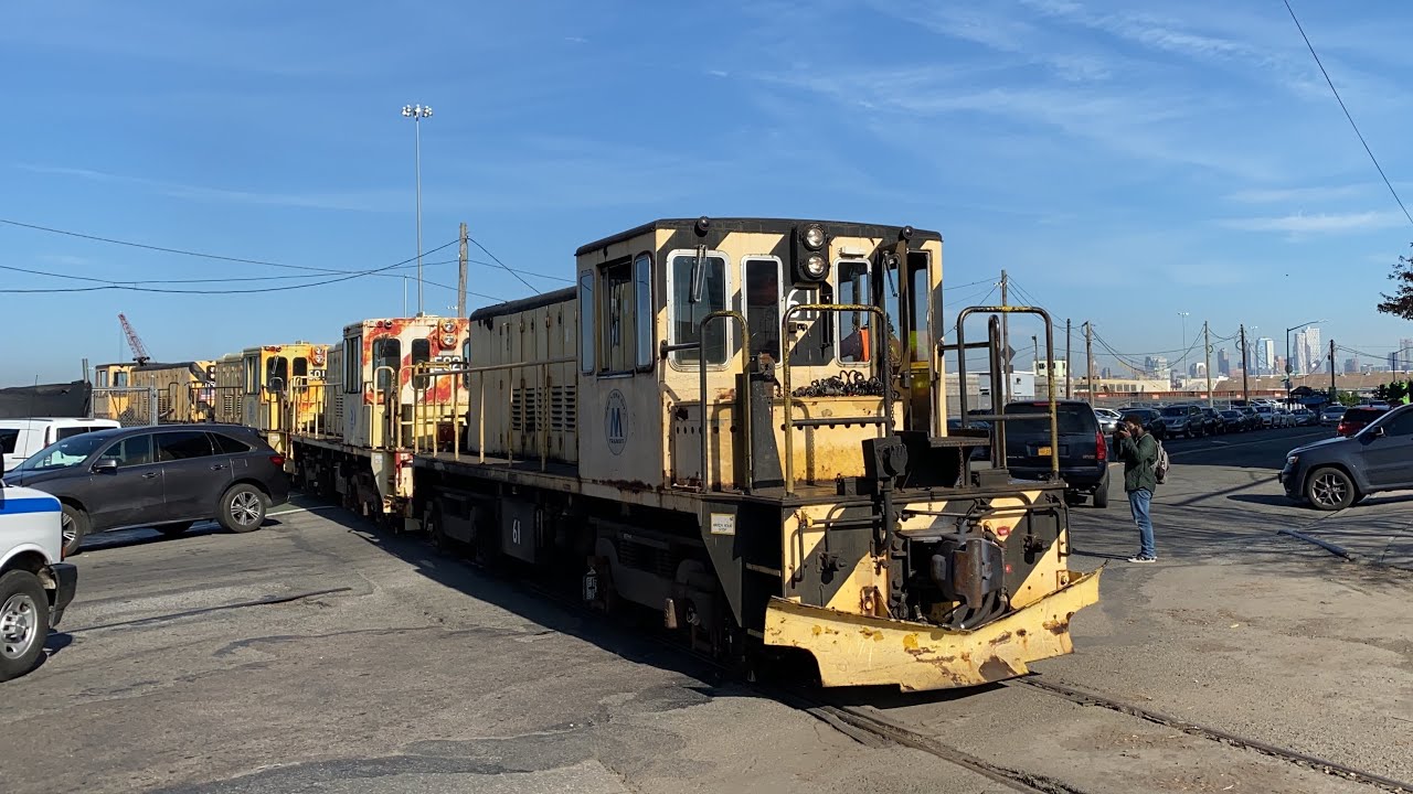 R77E locomotives being towed by R52 Diesel locomotives through the South Brooklyn Railway