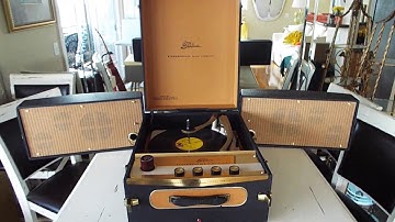 Symphonic STEREO record player playing a 33.3 RPM LP record.