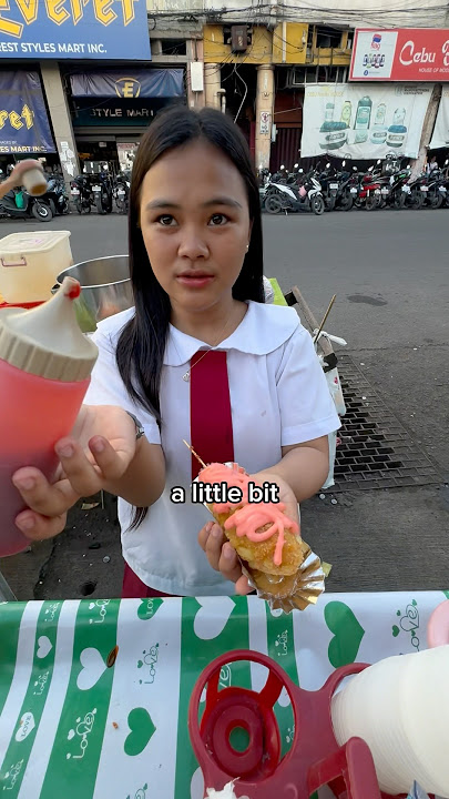 $0.55 pink corn dog 🌭 #philippines #streetfood