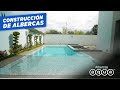 Construccin de piscina con acabados en color tornasol  albercas aqua