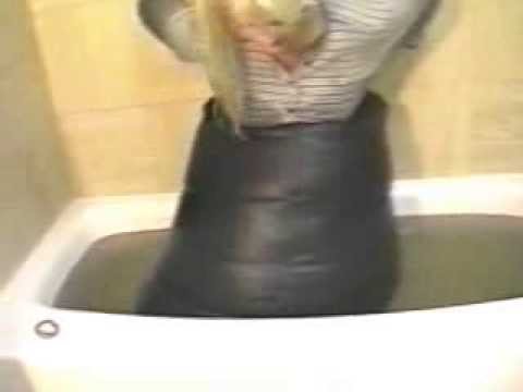 Leather skirt girl in bath
