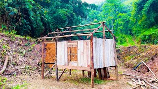 Install wooden house windows. Completing the stairs for the wooden house in the forest