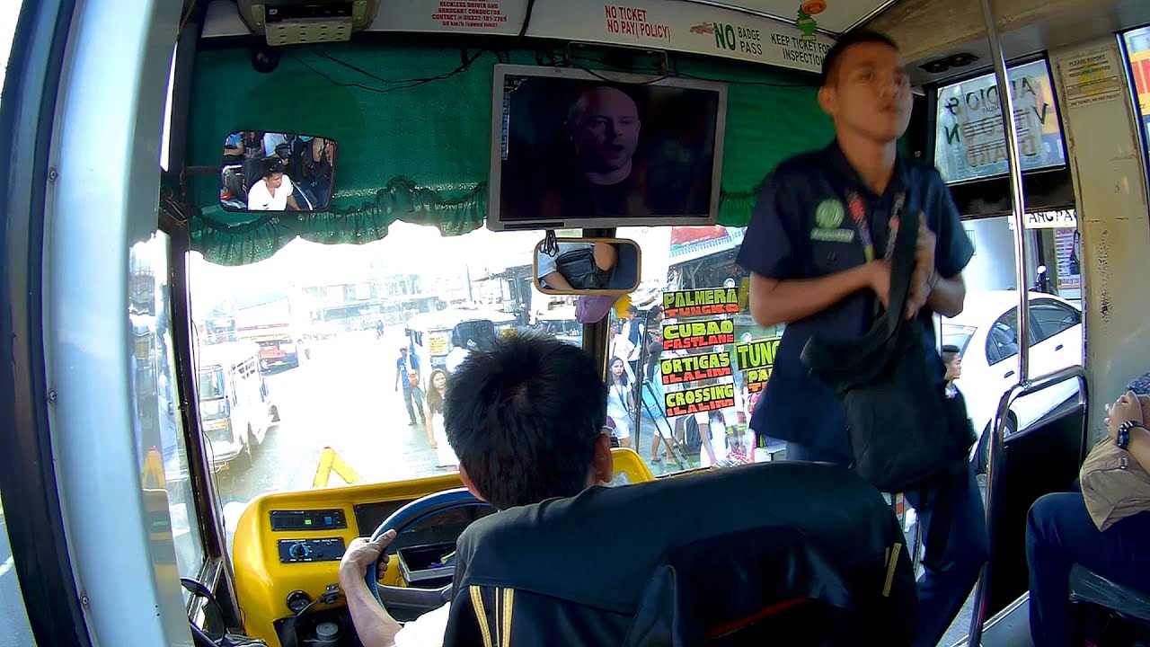 Philippines, people boarding a bus in Metro Manila