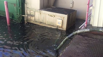Quick way to remove waterPumping out a flooded loading dock at Office Depot. Due to hurricane Michel