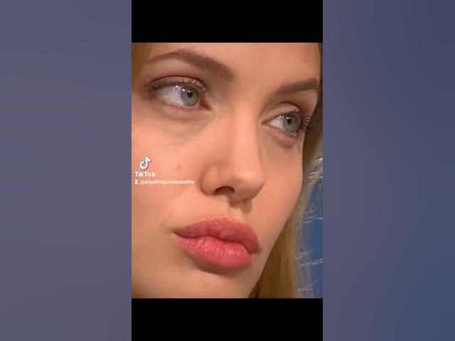 Angelina Jolie plays with her lips