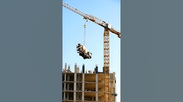 Crane Topples Over While Lifting Heavy Load on Construction Site