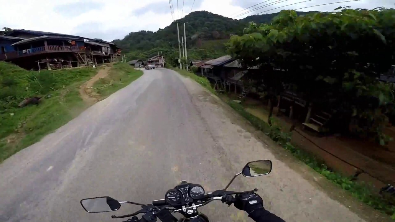 Riding through villages in NE Laos