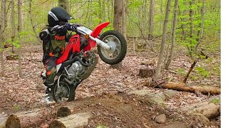 9 year old rocking the single track on a Honda CRF50