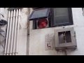 (Old video) Industrial/commercial exhaust fan in an alley