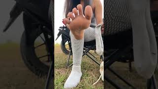 Taking Off The Socks To Have A Look On Bare Soles