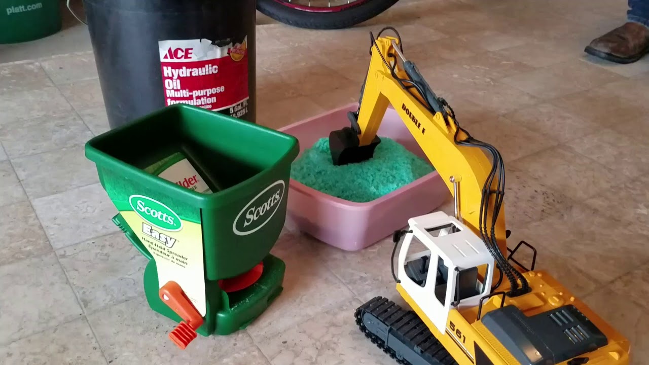 Double E 561 excavator loading ice melt the slow way YouTube