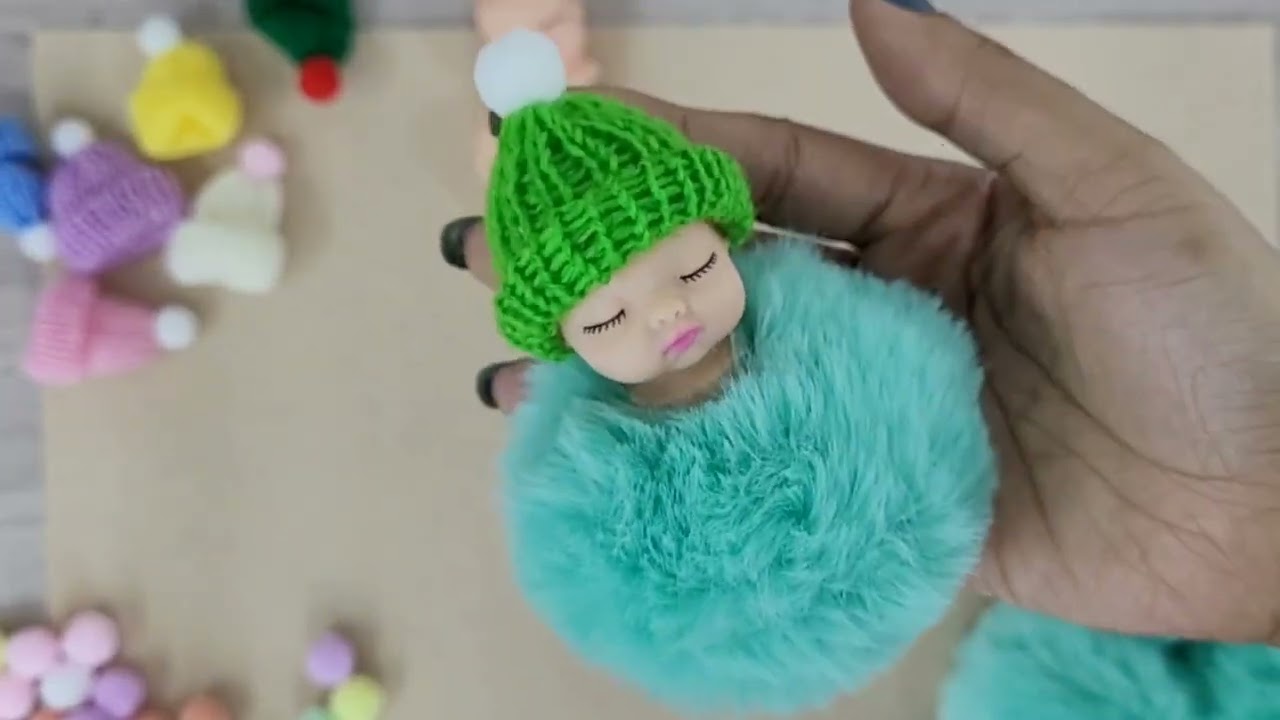 Chaveiro bebê de pompom