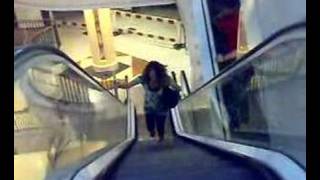 Charlie running up the escalator