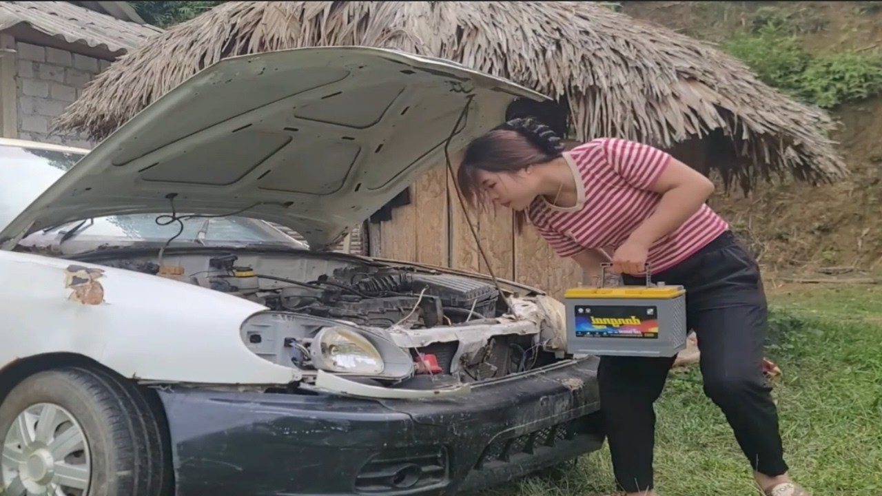 The beautiful girl's skills are extraordinary because she repaired the car herself