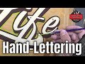 Hand-lettering a skateboard deck
