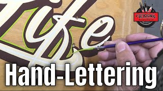Hand-lettering a skateboard deck
