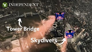 Skydivers soar through Tower Bridge on wingsuit flight after 3,000ft helicopter jump