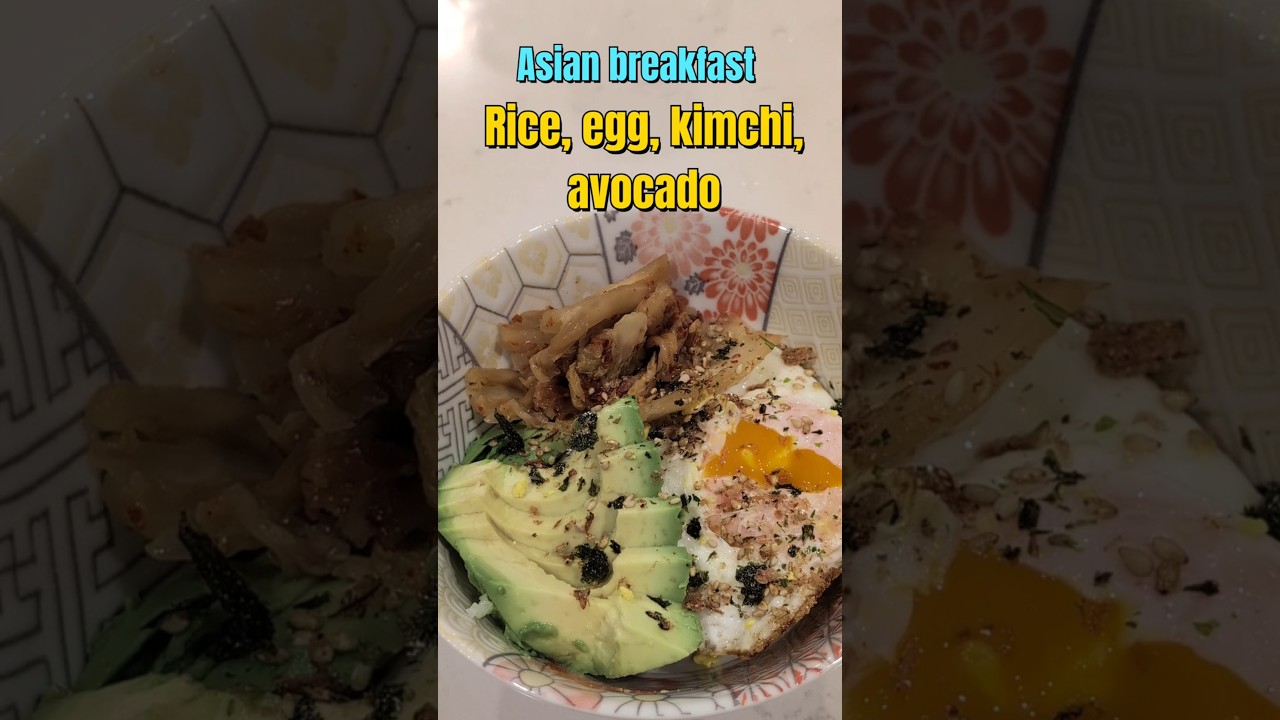 Asian breakfast - rice, fried egg, kimchi, avocado 