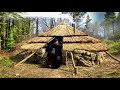 Building of a round bushcraft dugout for survival in the wild