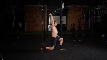Single Arm Dumbbell Overhead Walking Lunge
