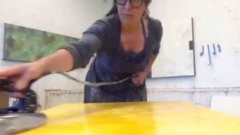 In the Studio with Elise Wagner: Fusing encaustic layers with an iron.